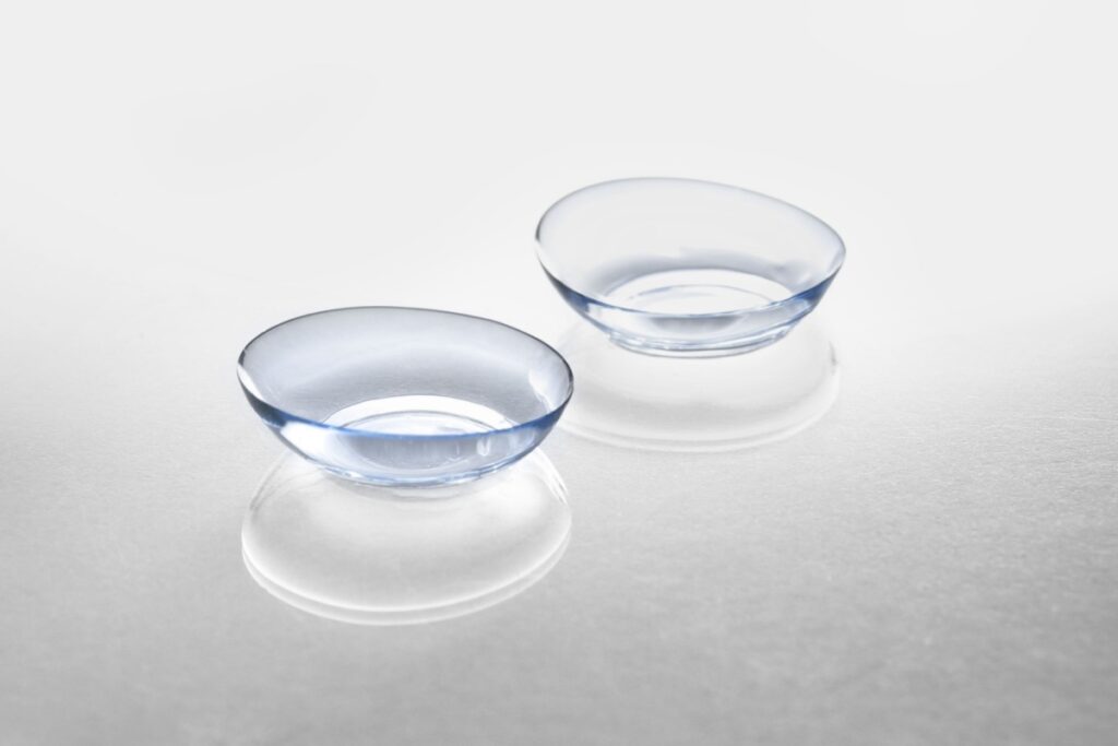 A pair of contact lenses resting on a white counter
